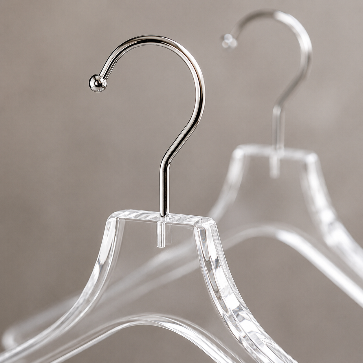 Close-up detail of a crystal-clear acrylic hanger