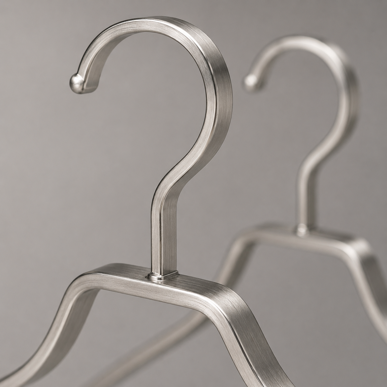 Close-up of brushed stainless steel texture and hook connection 